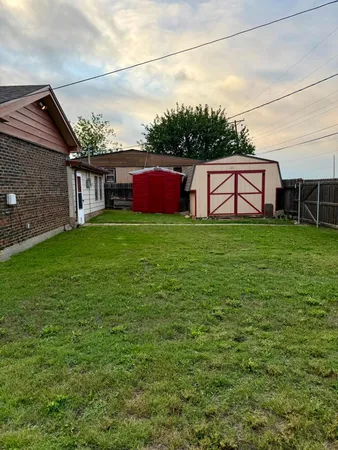 a view of a backyard of the house