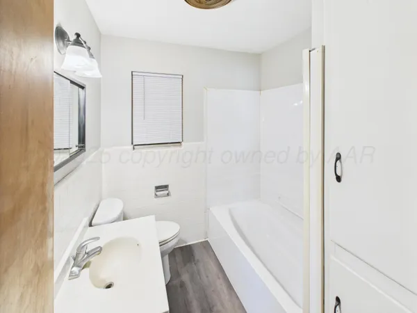 a bathroom with a sink and a bathtub