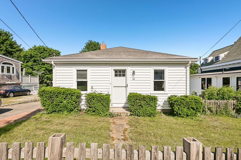 42 East Main Street Gloucester, MA 01930 - Photo 1 of 25 a front view of a house with garden