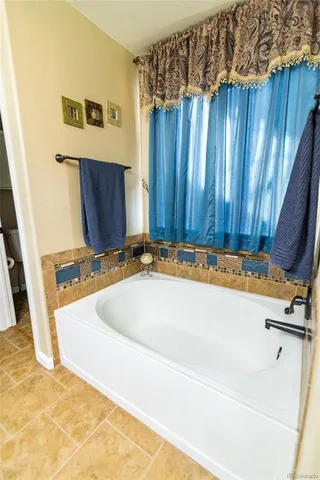 a white bath tub sitting in a bathroom