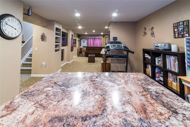 a kitchen with furniture and view of kitchen