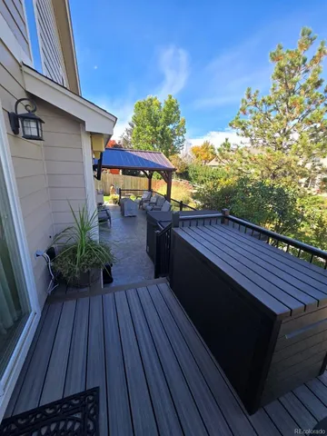 a backyard of a house with wooden floor