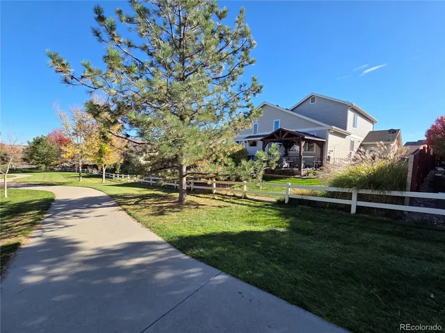 a view of swimming pool is middle in the garden