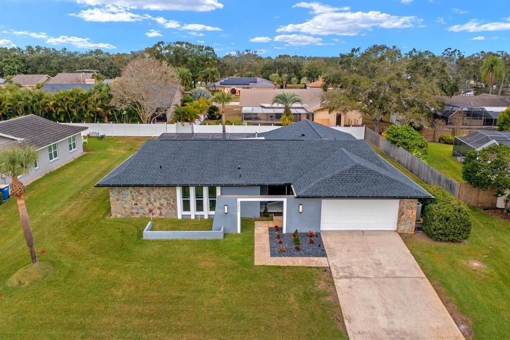 a aerial view of a house with swimming pool