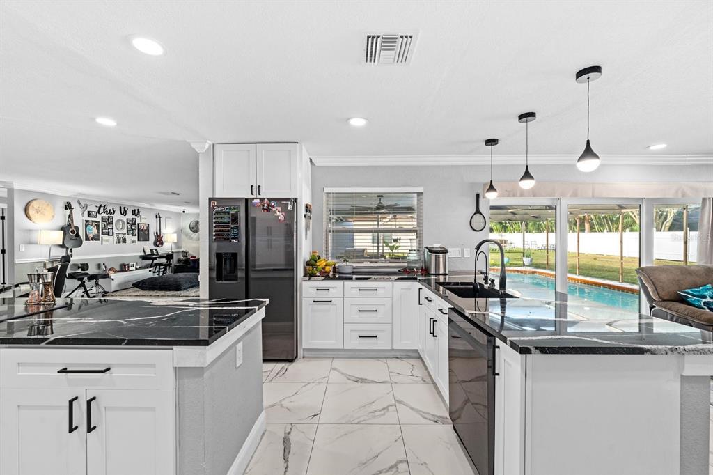 2850 Landover Drive Clearwater, FL 33761 - Photo 12 of 33 a kitchen with stainless steel appliances granite countertop a sink and cabinets