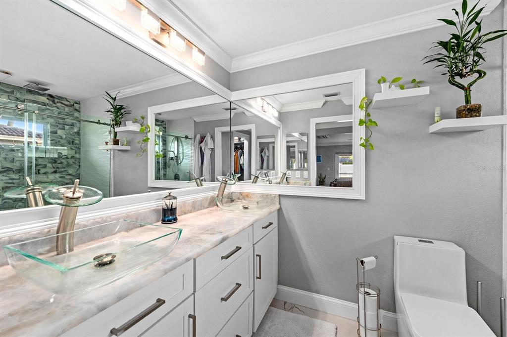 2850 Landover Drive Clearwater, FL 33761 - Photo 17 of 33 a spacious bathroom with a granite countertop sink mirror and vanity