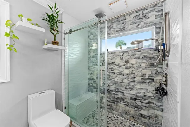 a view of a livingroom with furniture and a flat screen tv