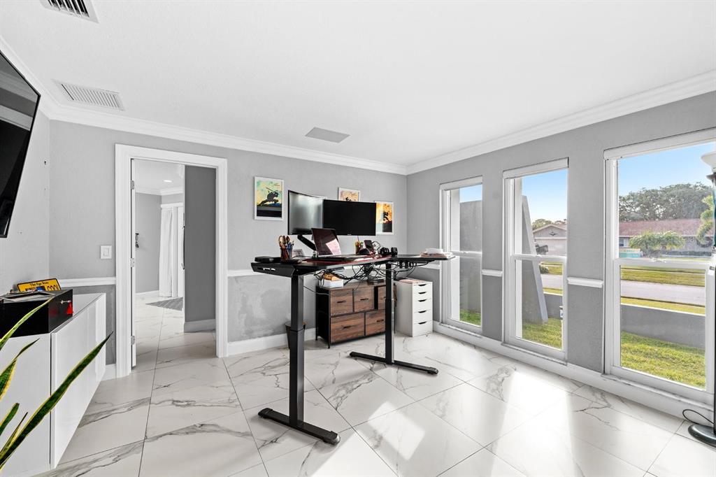 2850 Landover Drive Clearwater, FL 33761 - Photo 19 of 33 a view of a livingroom with furniture and a flat screen tv