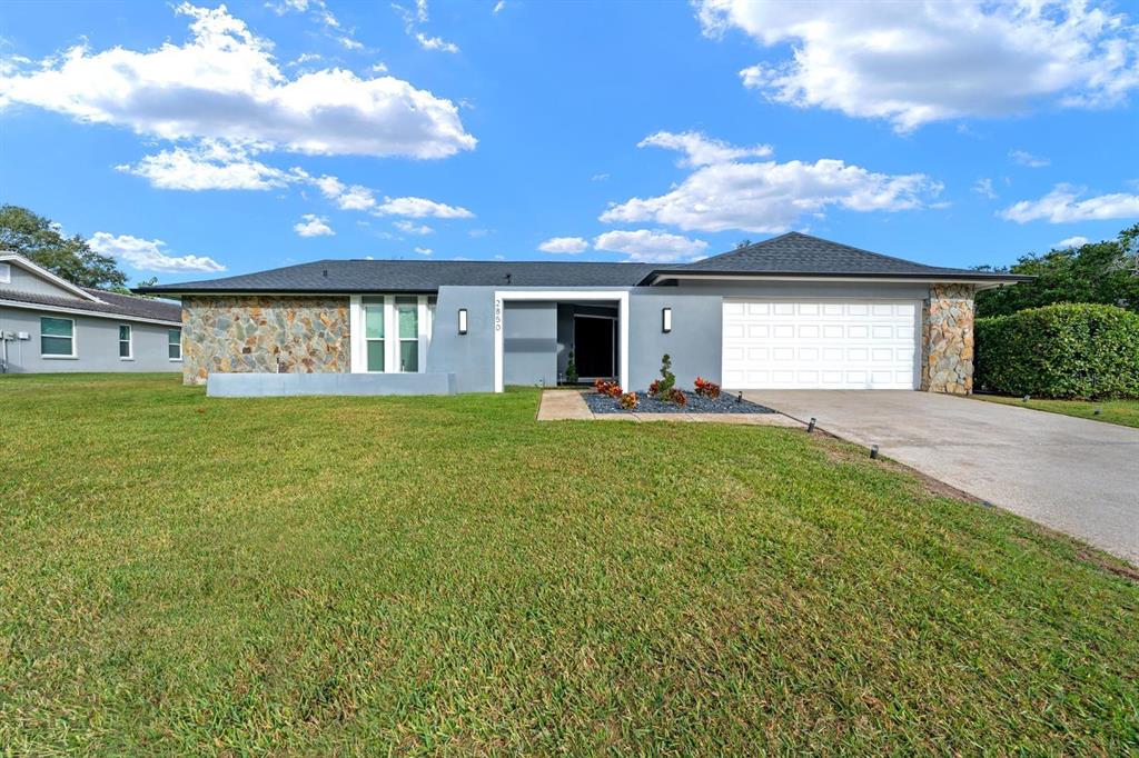 2850 Landover Drive Clearwater, FL 33761 - Photo 2 of 33 a view of a house with a yard and potted plants