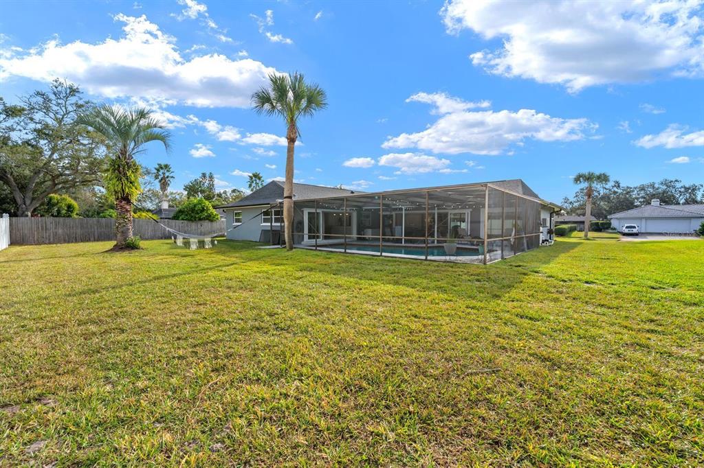 2850 Landover Drive Clearwater, FL 33761 - Photo 28 of 33 a view of a swimming pool with an outdoor seating