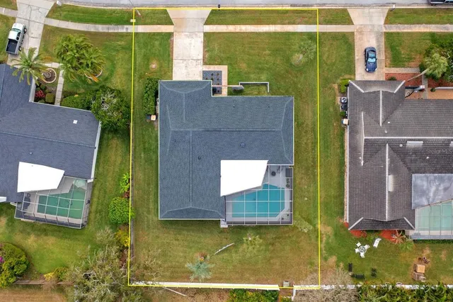 an aerial view of residential building with parking