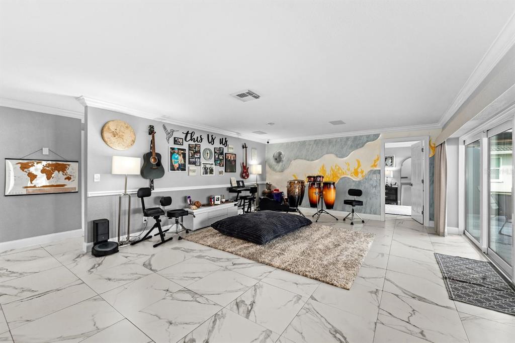 2850 Landover Drive Clearwater, FL 33761 - Photo 6 of 33 a living room with furniture a window and gym equipment