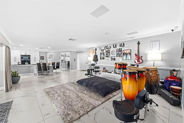 a bedroom with furniture and a flat screen tv