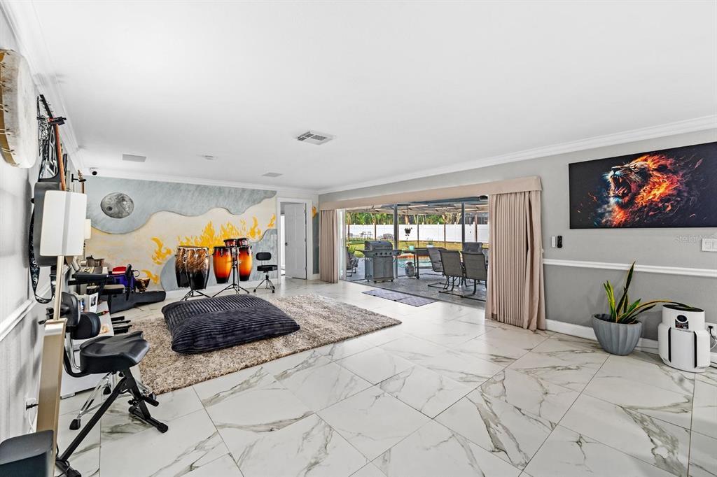 2850 Landover Drive Clearwater, FL 33761 - Photo 8 of 33 a bedroom with furniture and a flat screen tv