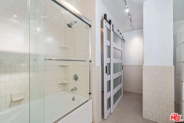 a view of a storage & utility room with a washer and dryer