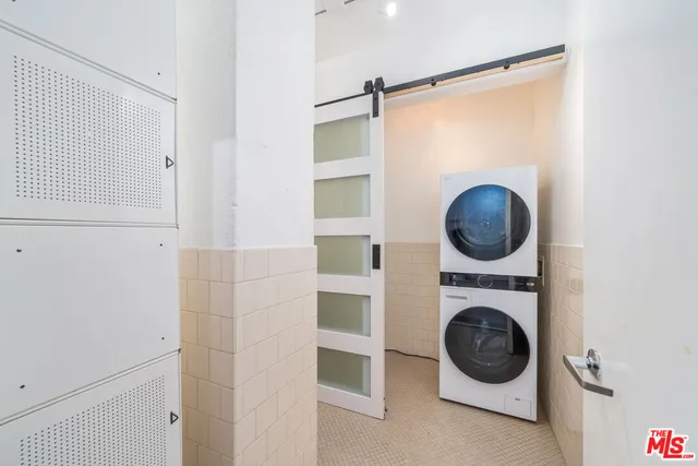 a bathroom with a glass shower door and a bathtub