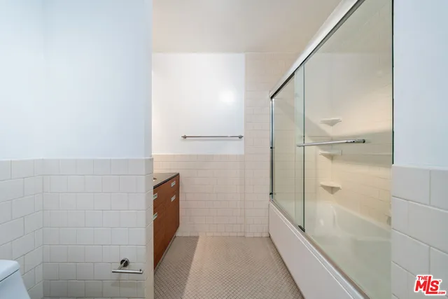 a kitchen with stainless steel appliances a stove a sink and a microwave