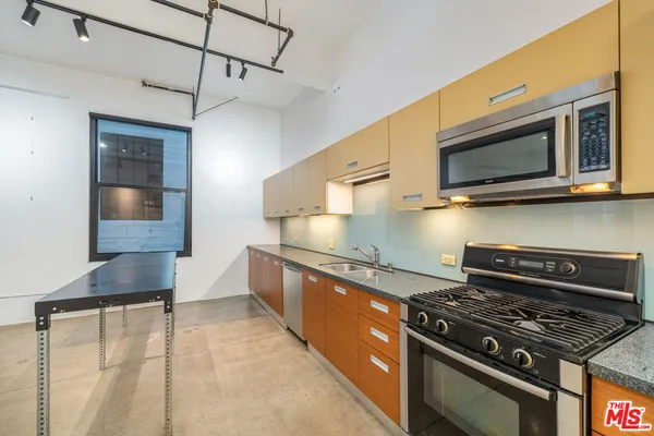 a kitchen with a stove and a microwave
