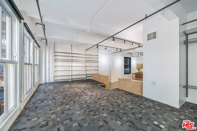 a view of a closet area with living room