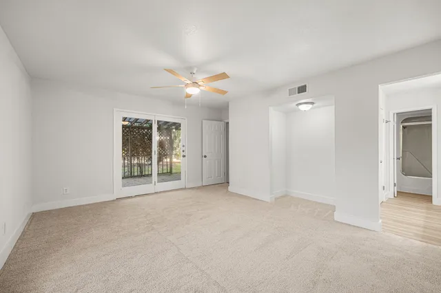 a view of an empty room with a window