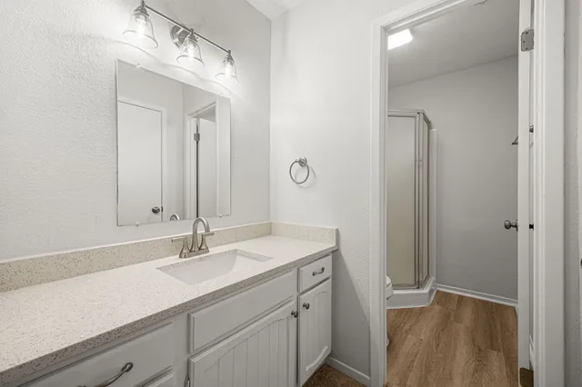 a bathroom with a sink double vanity and a mirror