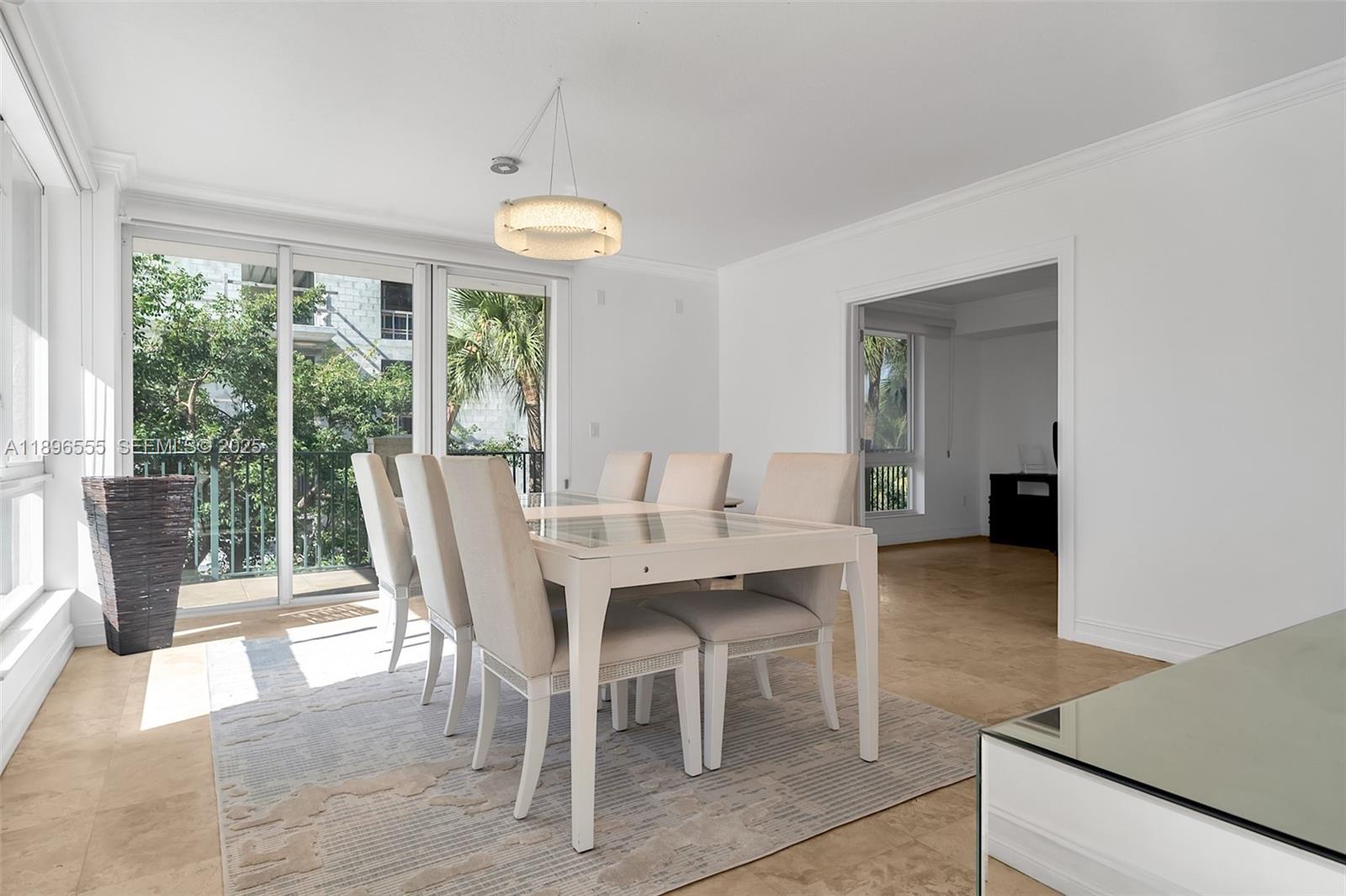 9 Northeast 20th Avenue, Unit 302 Deerfield Beach, FL 33441 - Photo 13 of 55 a view of a dining room with furniture window and outside view