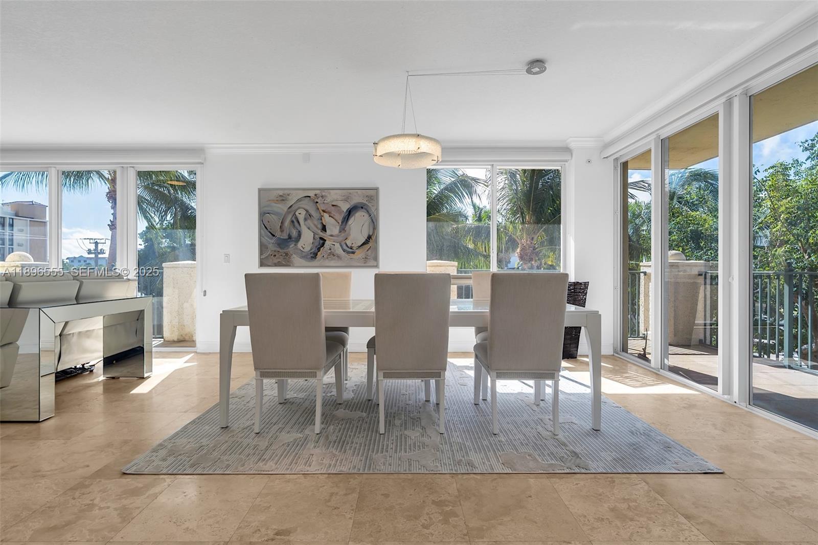 9 Northeast 20th Avenue, Unit 302 Deerfield Beach, FL 33441 - Photo 15 of 55 a view of a dining room with furniture window and outside view