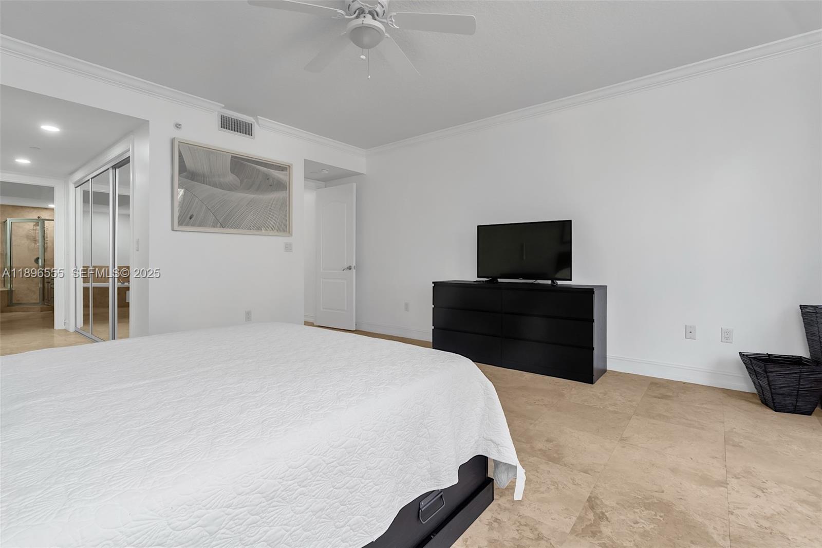 9 Northeast 20th Avenue, Unit 302 Deerfield Beach, FL 33441 - Photo 21 of 55 a bedroom with a bed and a television