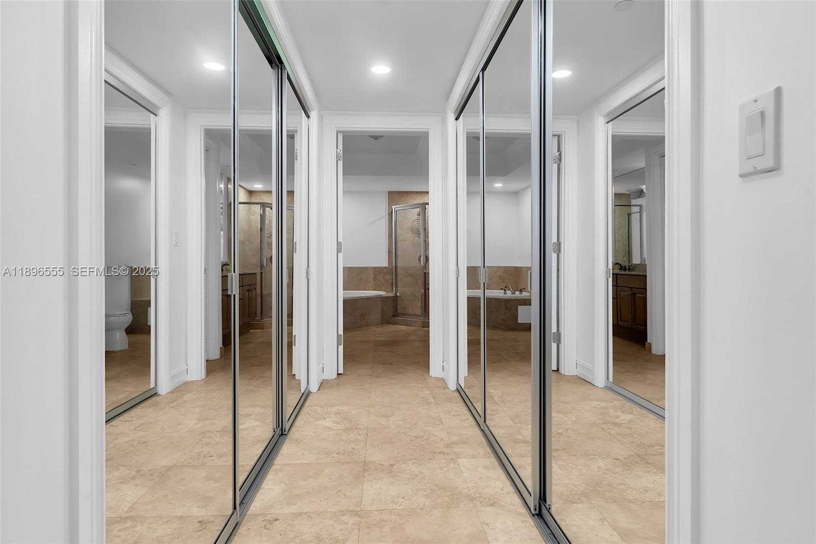 9 Northeast 20th Avenue, Unit 302 Deerfield Beach, FL 33441 - Photo 23 of 55 a view of a hallway with wooden shelves