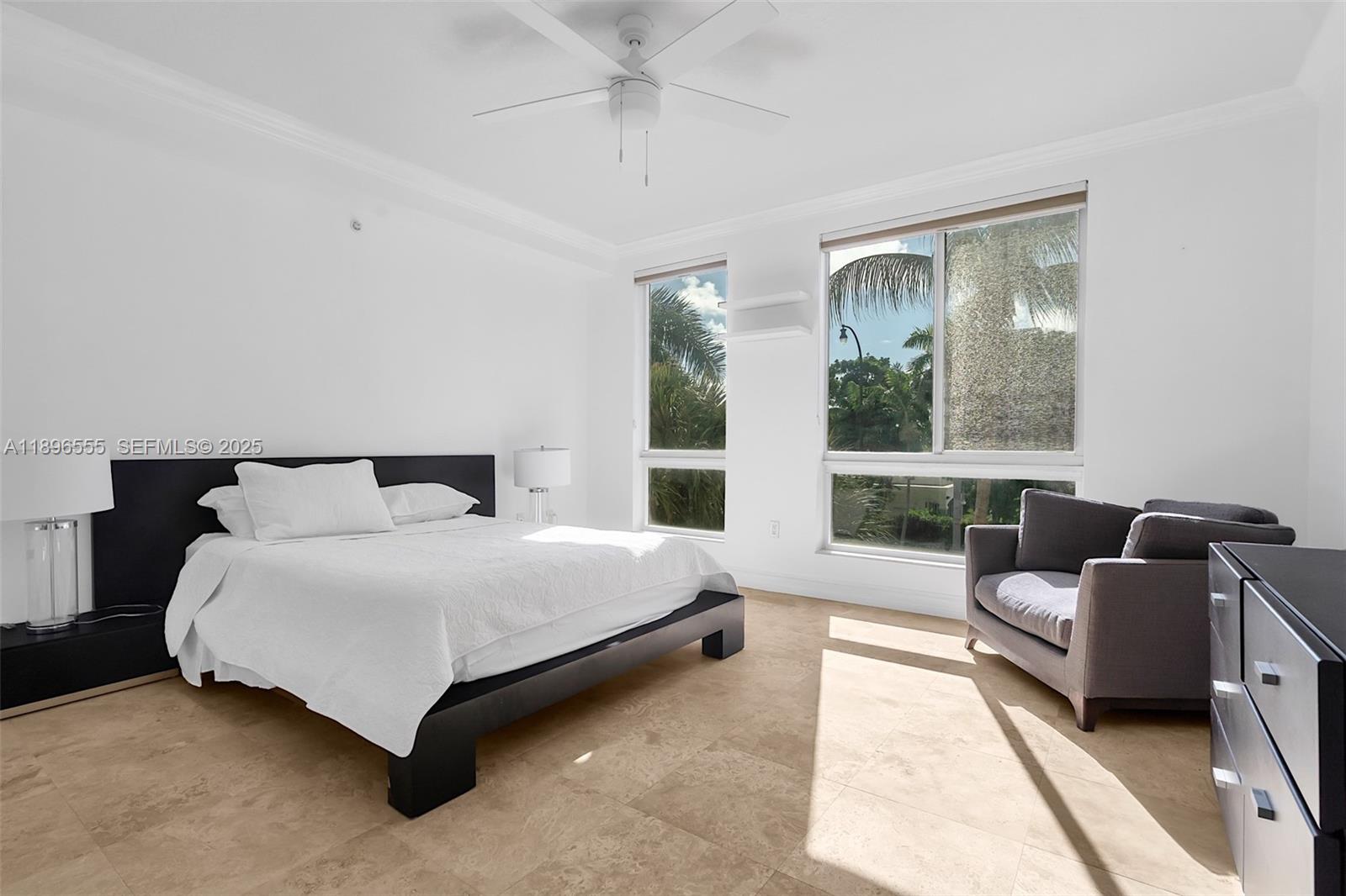 9 Northeast 20th Avenue, Unit 302 Deerfield Beach, FL 33441 - Photo 25 of 55 a bedroom with a bed couch and window