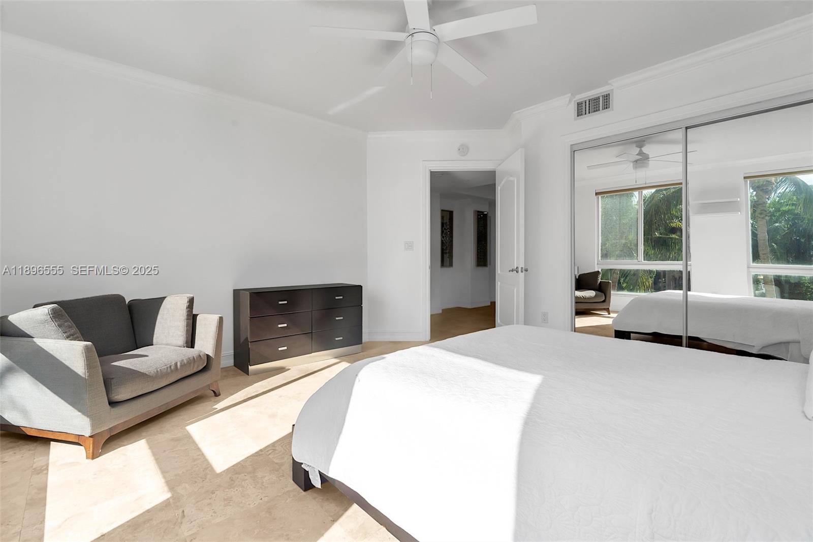 9 Northeast 20th Avenue, Unit 302 Deerfield Beach, FL 33441 - Photo 27 of 55 a spacious bedroom with a bed and glass window