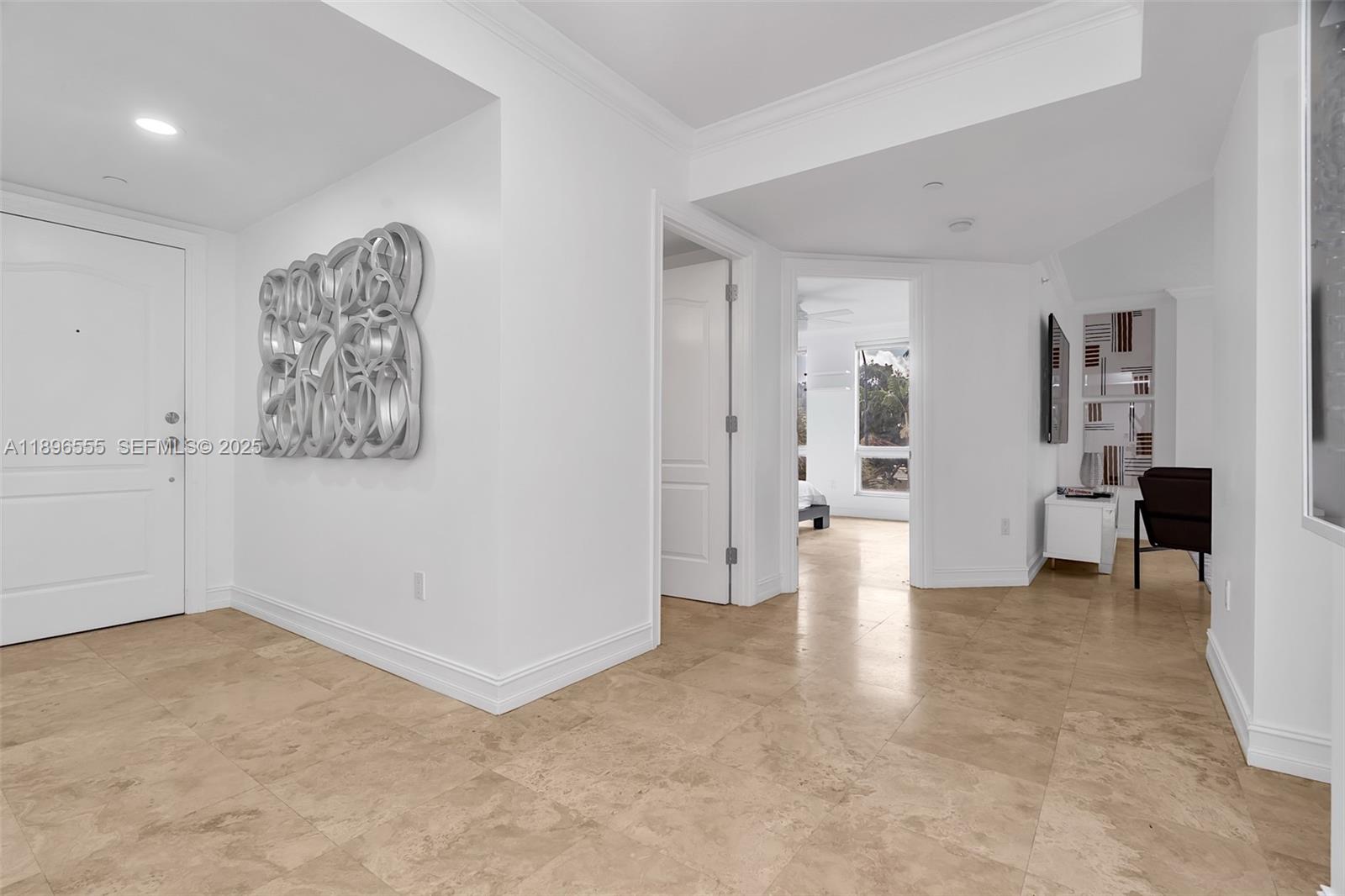 9 Northeast 20th Avenue, Unit 302 Deerfield Beach, FL 33441 - Photo 3 of 55 wooden floor in an empty room and a bathroom