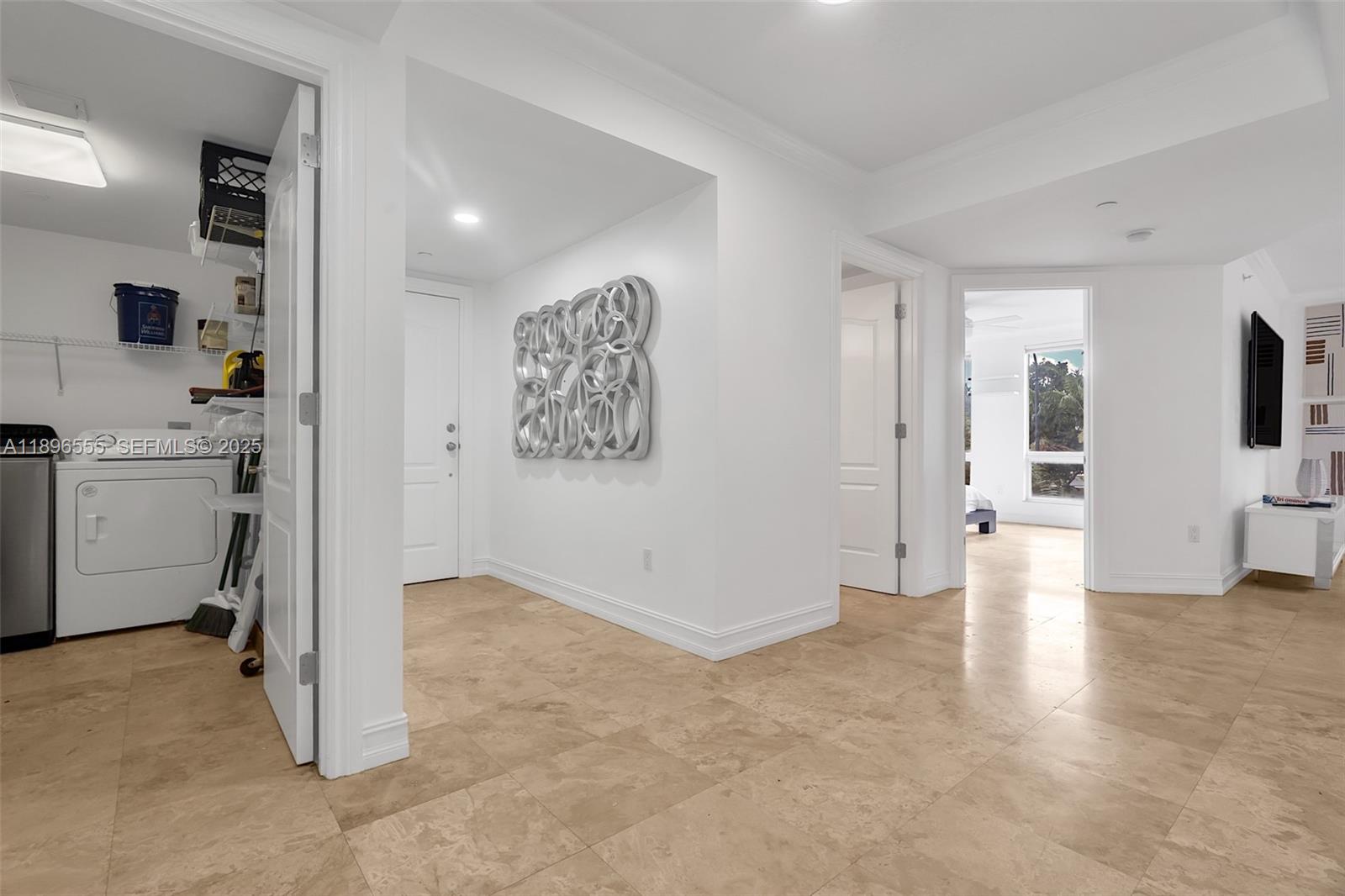 9 Northeast 20th Avenue, Unit 302 Deerfield Beach, FL 33441 - Photo 36 of 55 a view of a kitchen with a sink and a refrigerator