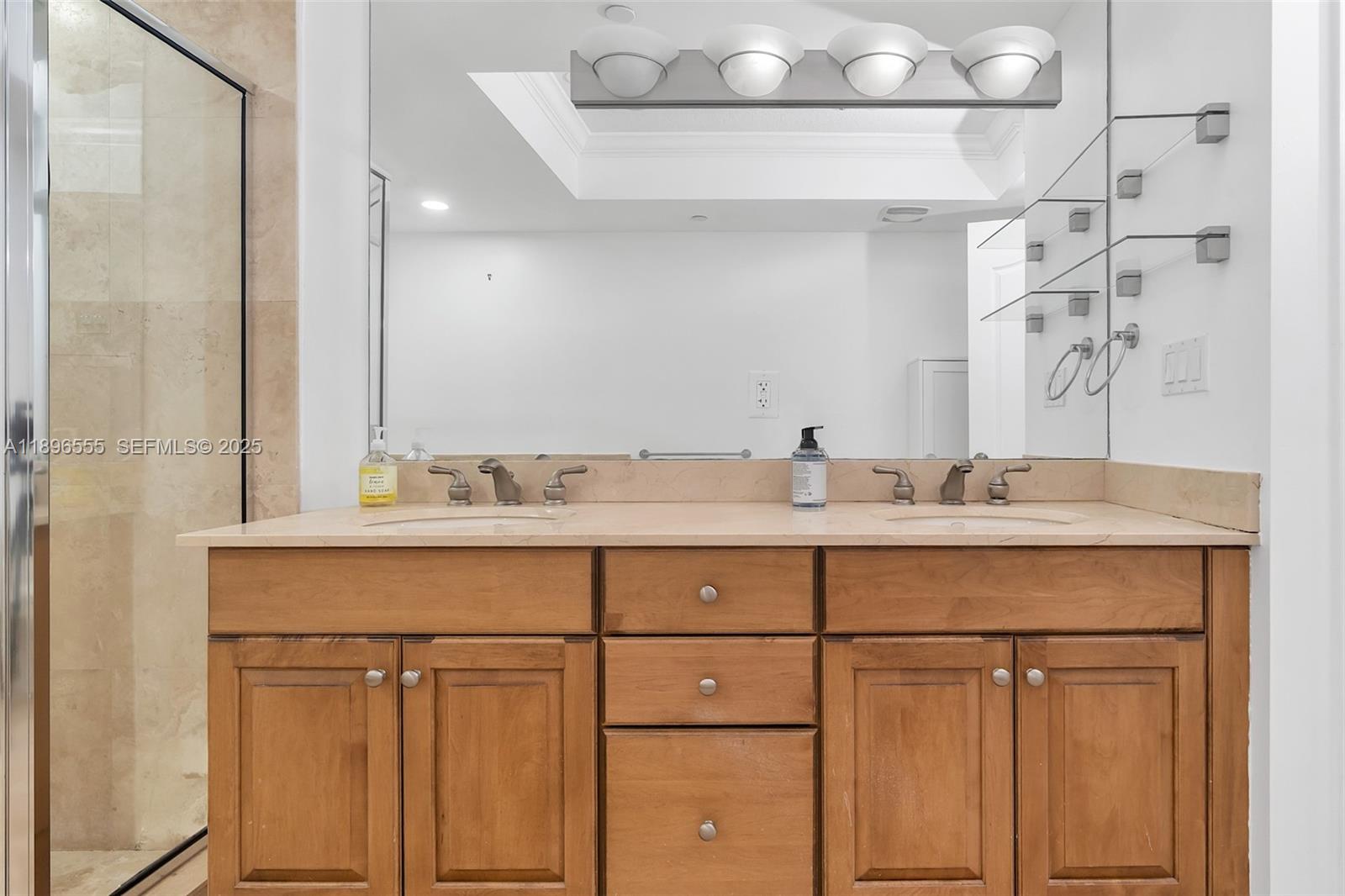 9 Northeast 20th Avenue, Unit 302 Deerfield Beach, FL 33441 - Photo 41 of 55 a bathroom with a sink vanity and mirror