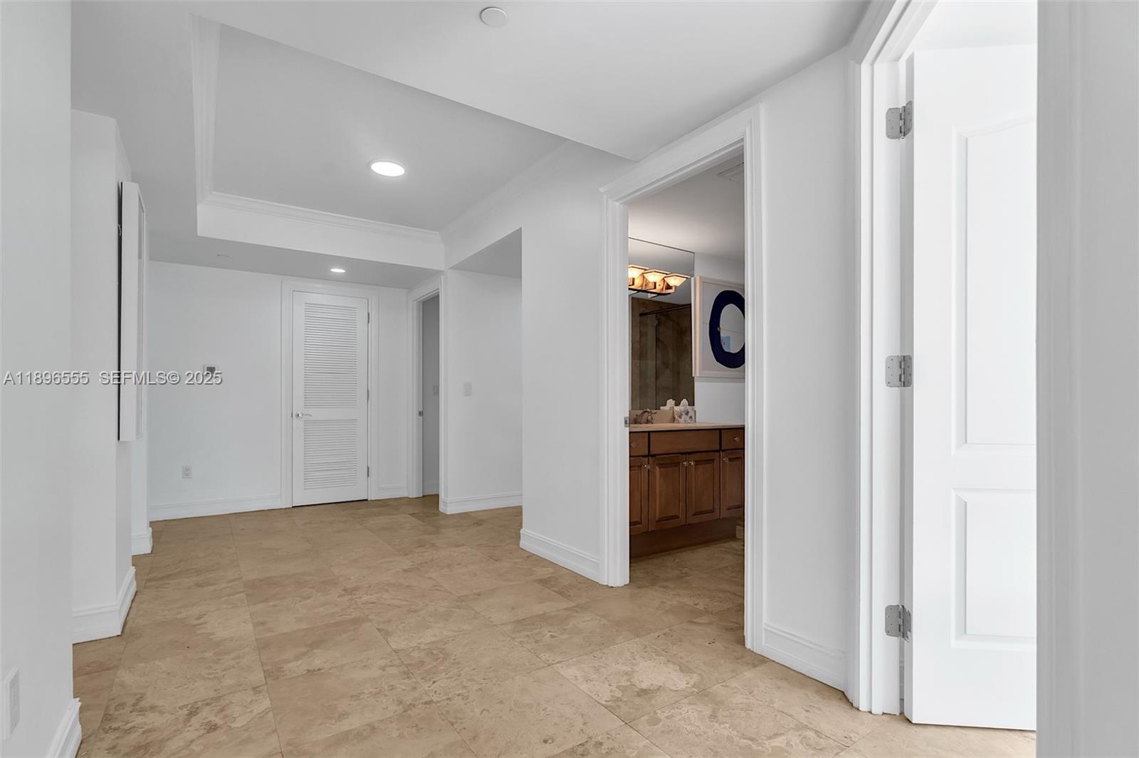 9 Northeast 20th Avenue, Unit 302 Deerfield Beach, FL 33441 - Photo 7 of 55 a view of a hallway with an entryway and livingroom