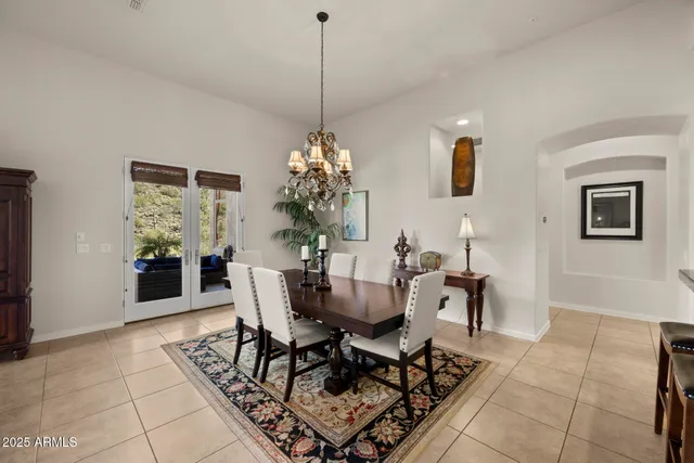 a view of a dining room with furniture and window
