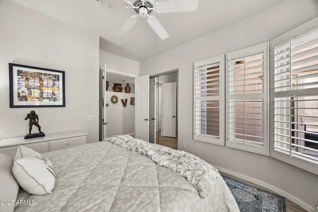 a bedroom with a large bed and a window