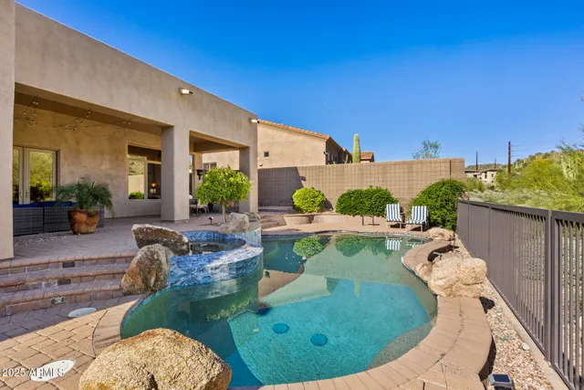 a view of a swimming pool with a patio