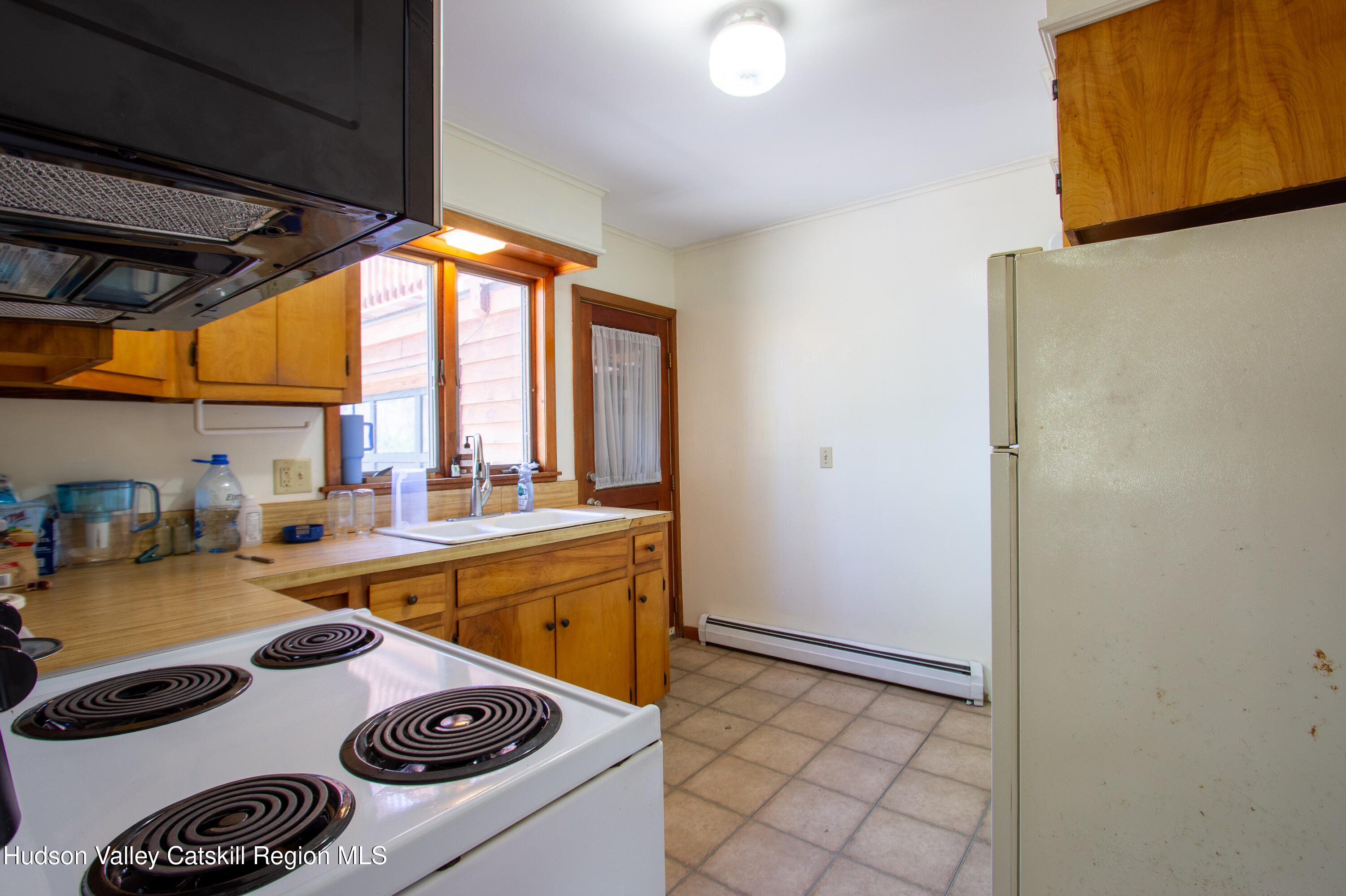 205 Fordham Road Valatie, NY 12184 - Photo 11 of 18 a kitchen that has a stove and a refrigerator