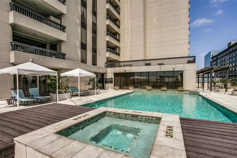 a view of a backyard with sitting area