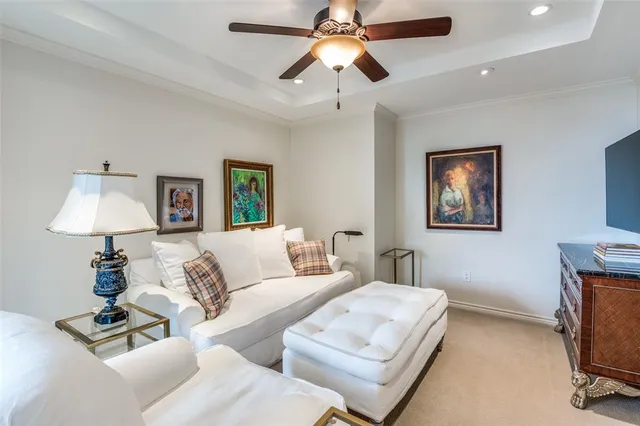 a view of a dining room with furniture a chandelier and wooden floor