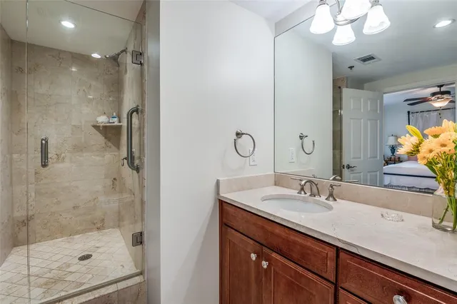 a bedroom with furniture and a lamp