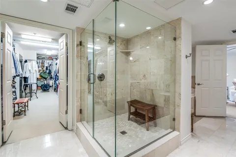 a living room with furniture a couch and a flat screen tv