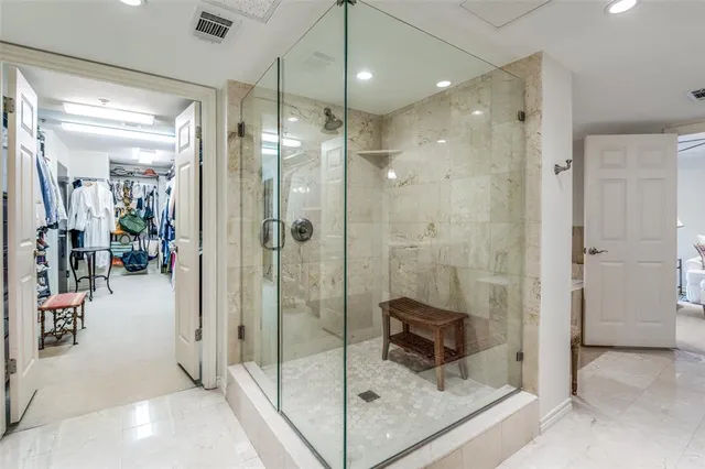 a living room with furniture a couch and a flat screen tv