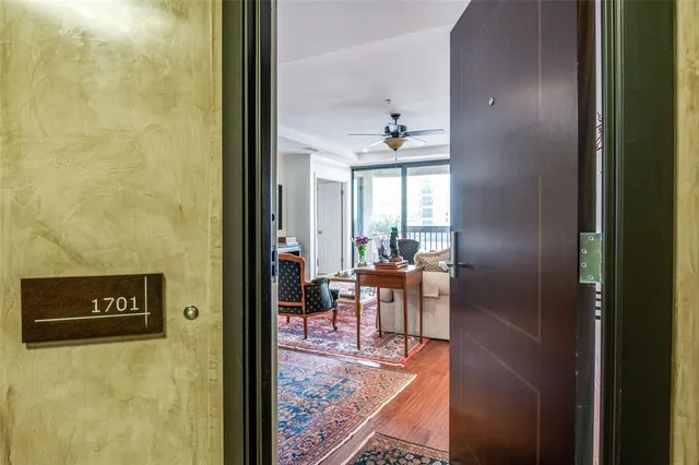 a view of a hallway with furniture and front door