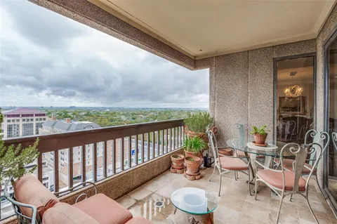 a bedroom with furniture and a flat screen tv