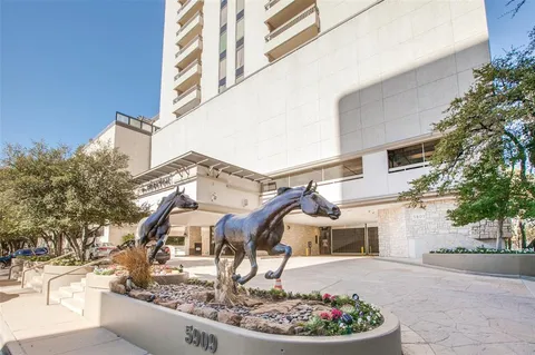 a balcony with furniture and a potted plant