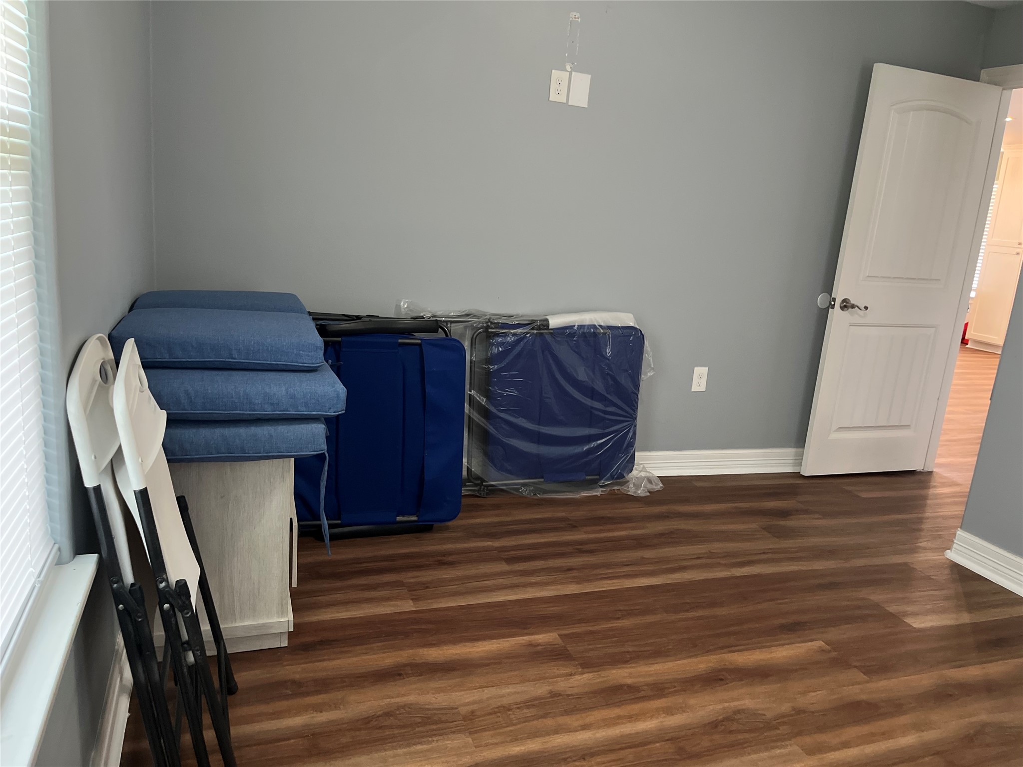 21511 Rio Villa Drive Houston, TX 77049 - Photo 41 of 45 a room with a closet and wooden floor