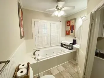 a bathroom with a bathtub and a shower