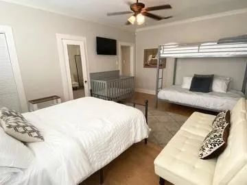 a bedroom with a bed and a tv